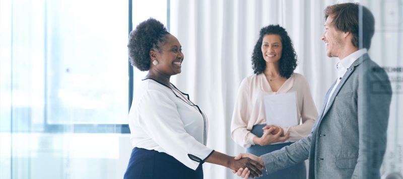 Employees shaking hands