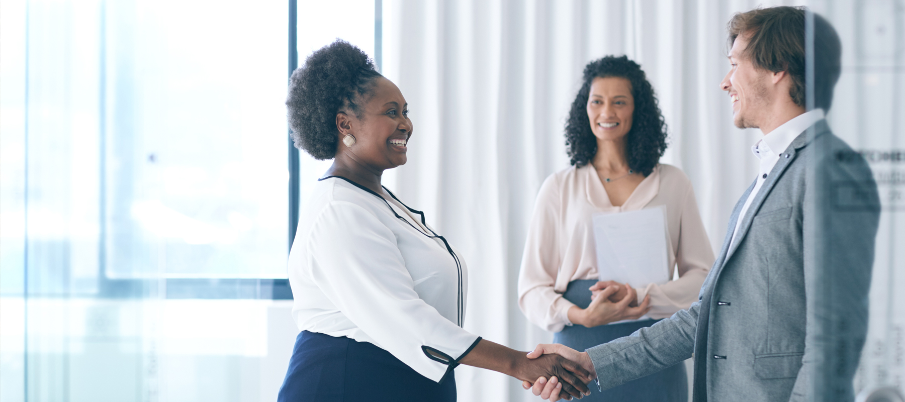 Employees shaking hands